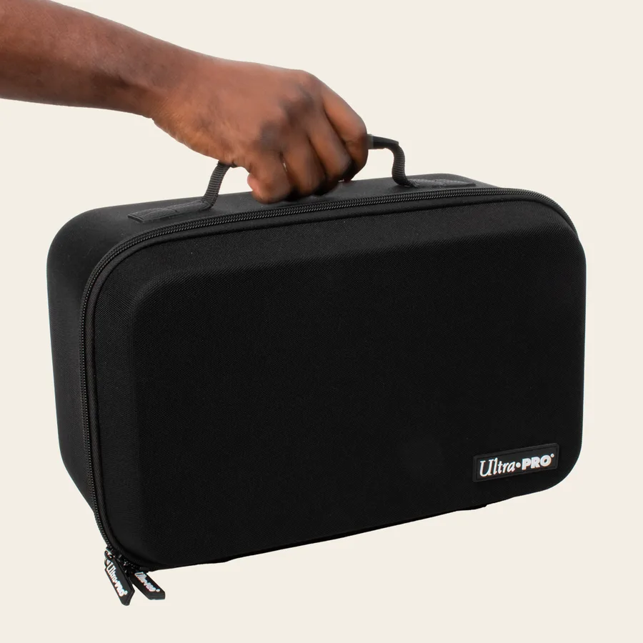 Ultra PRO Showcase Vault, a black zippered fabric case with a carry handle, held by one hand